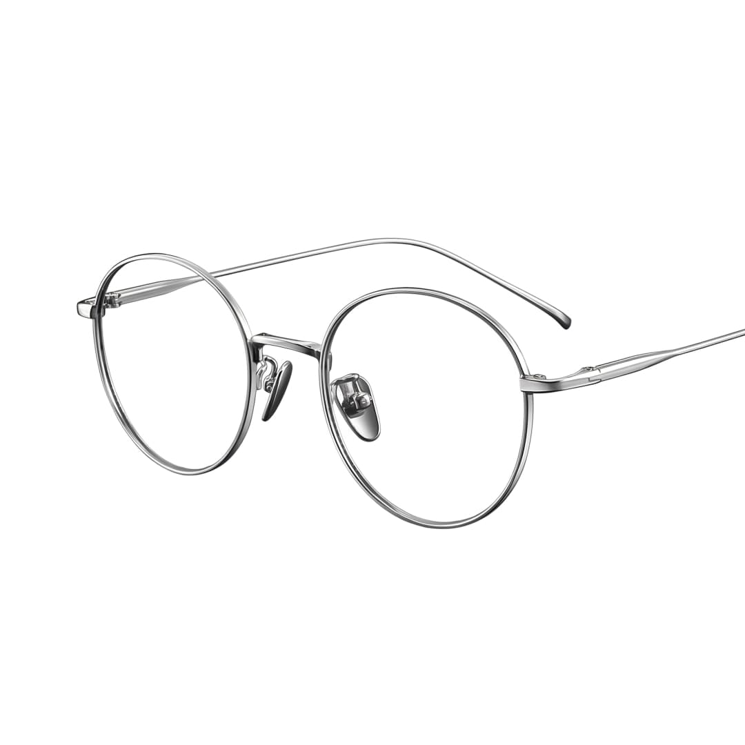 Round titanium wire glasses in glossy silver, photographed on a white backdrop.